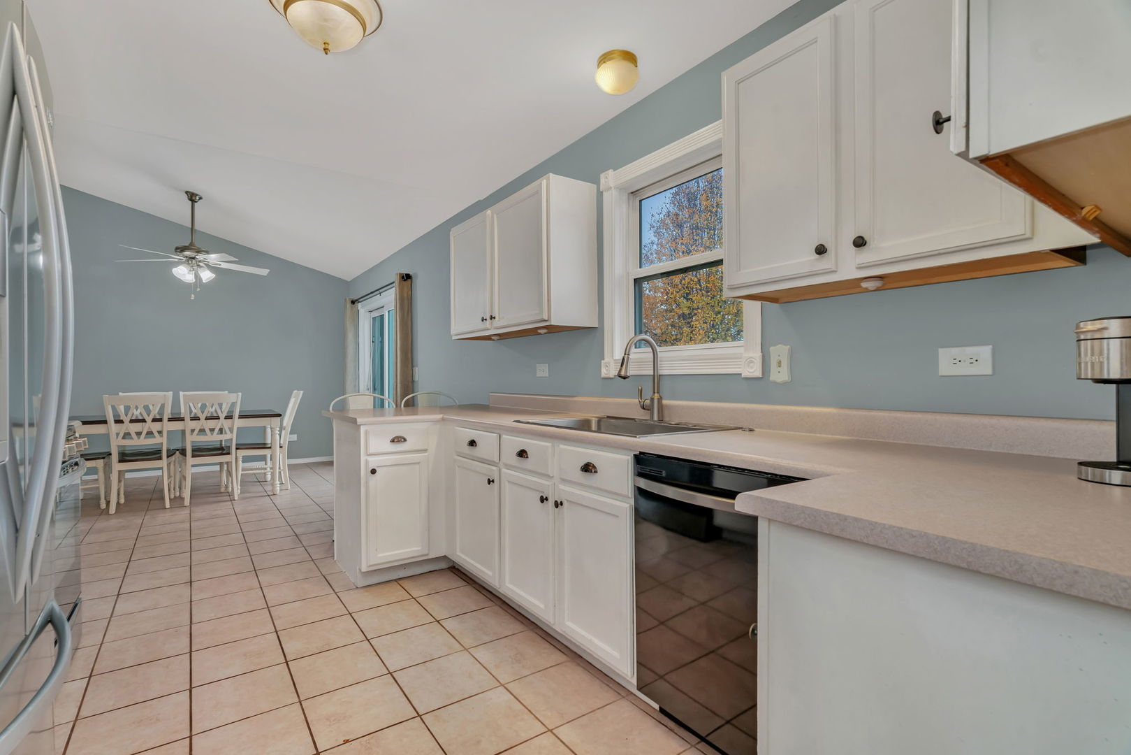 1605 Heritage Pointe Court Plainfield, IL 60586 - Photo 8 of 21 a kitchen with stainless steel appliances granite countertop a sink and cabinets