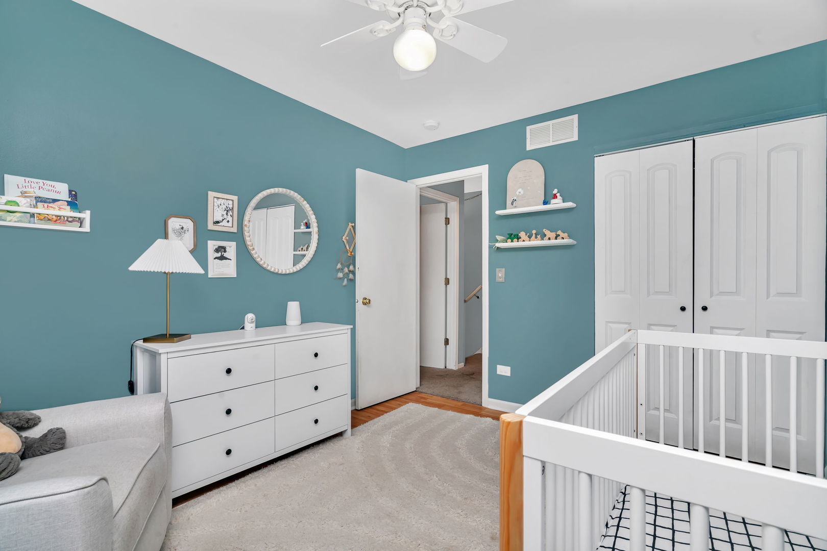 1605 Heritage Pointe Court Plainfield, IL 60586 - Photo 10 of 21 a living room with furniture and a baby crib
