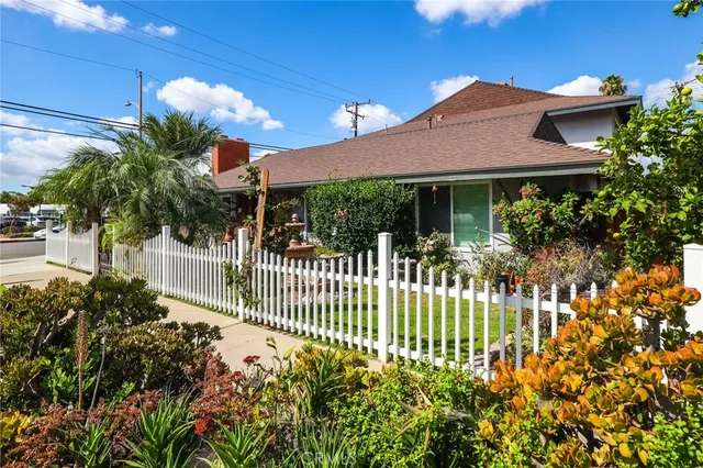 a front view of house and yard with green space