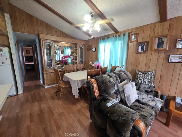 a living room with furniture fireplace and wooden floor