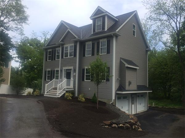 91 North Road Chelmsford, MA 01824 - Photo 1 of 27 a front view of a house with a yard
