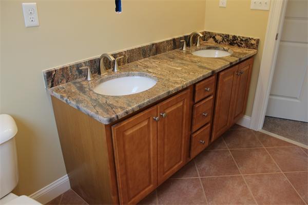 91 North Road Chelmsford, MA 01824 - Photo 18 of 27 a bathroom with a granite countertop sink and a mirror