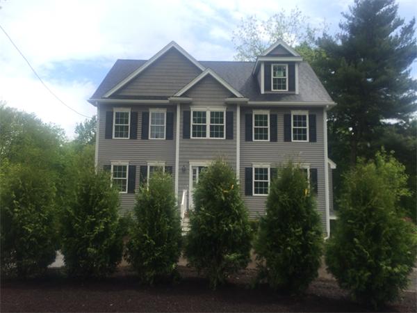 91 North Road Chelmsford, MA 01824 - Photo 3 of 27 a front view of a house with a yard