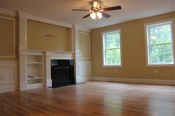 91 North Road Chelmsford, MA 01824 - Photo 10 of 27 a view of an empty room with a window and wooden floor