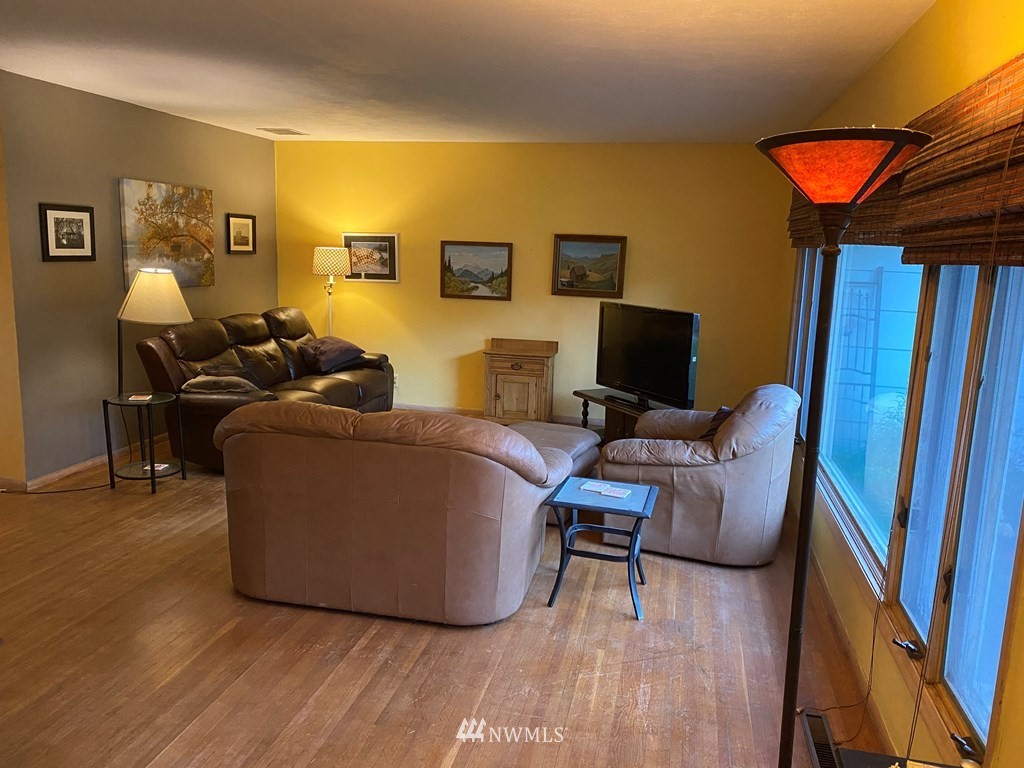 802 South 5th Street Dayton, WA 99328 - Photo 11 of 20 a living room with furniture and a flat screen tv