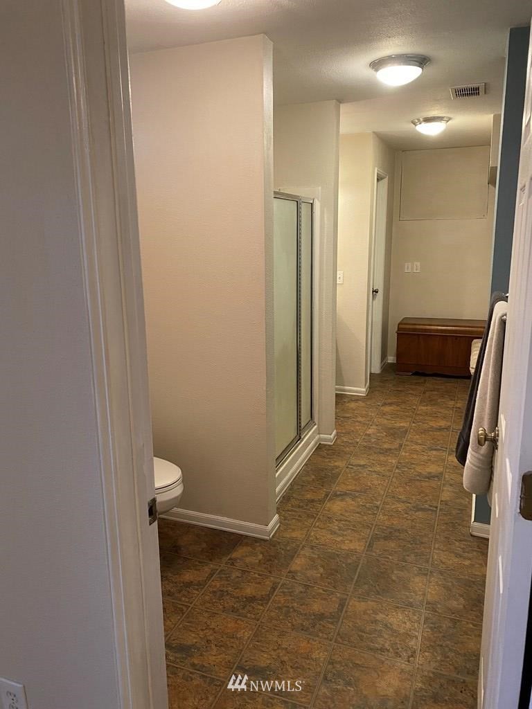 802 South 5th Street Dayton, WA 99328 - Photo 19 of 20 a bathroom with a sink a toilet and a shower