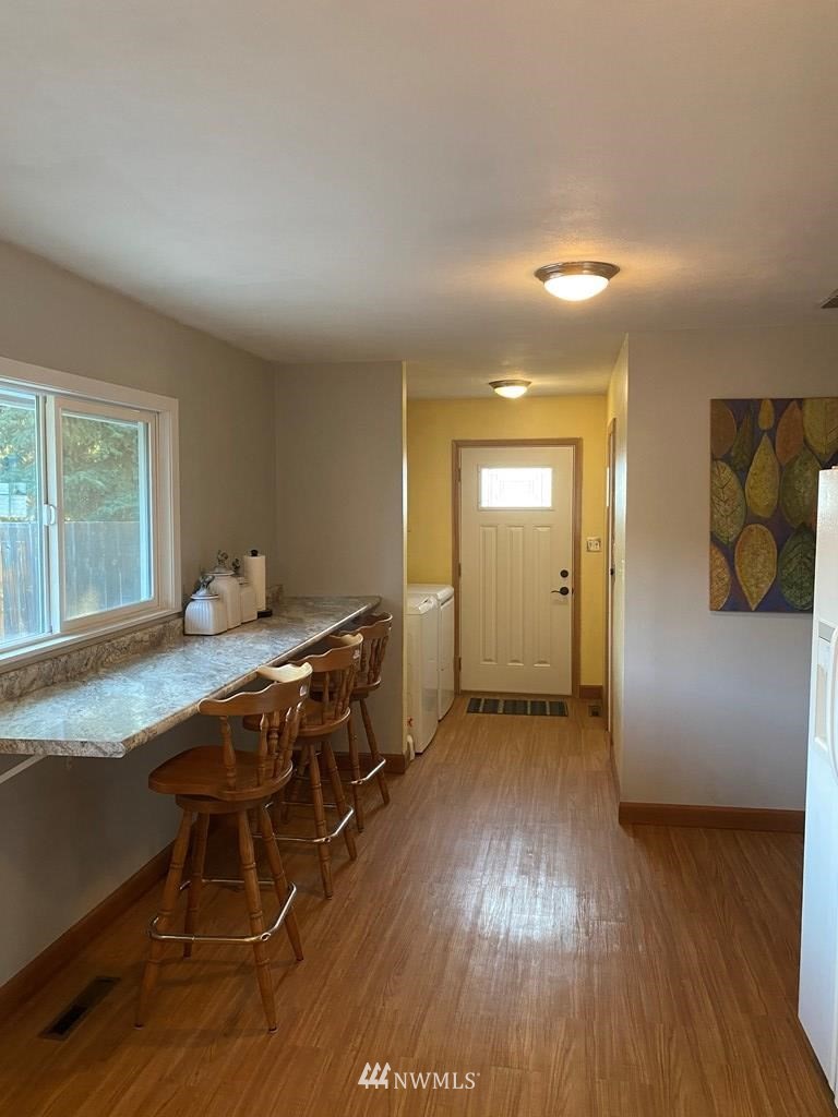 802 South 5th Street Dayton, WA 99328 - Photo 9 of 20 a workspace with wooden floor