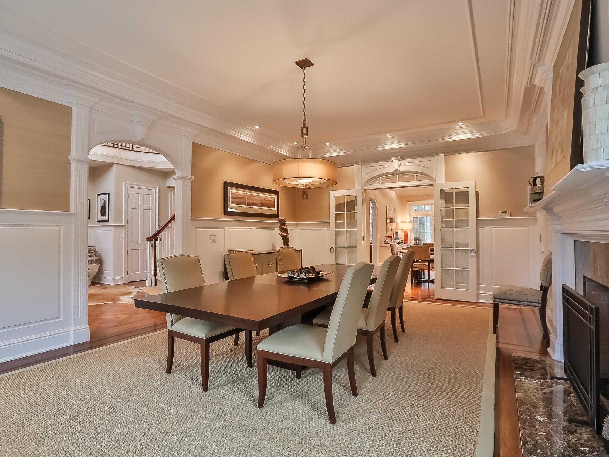 107 Dunning Road New Canaan, CT 06840 - Photo 11 of 31 a dining room with furniture and a chandelier