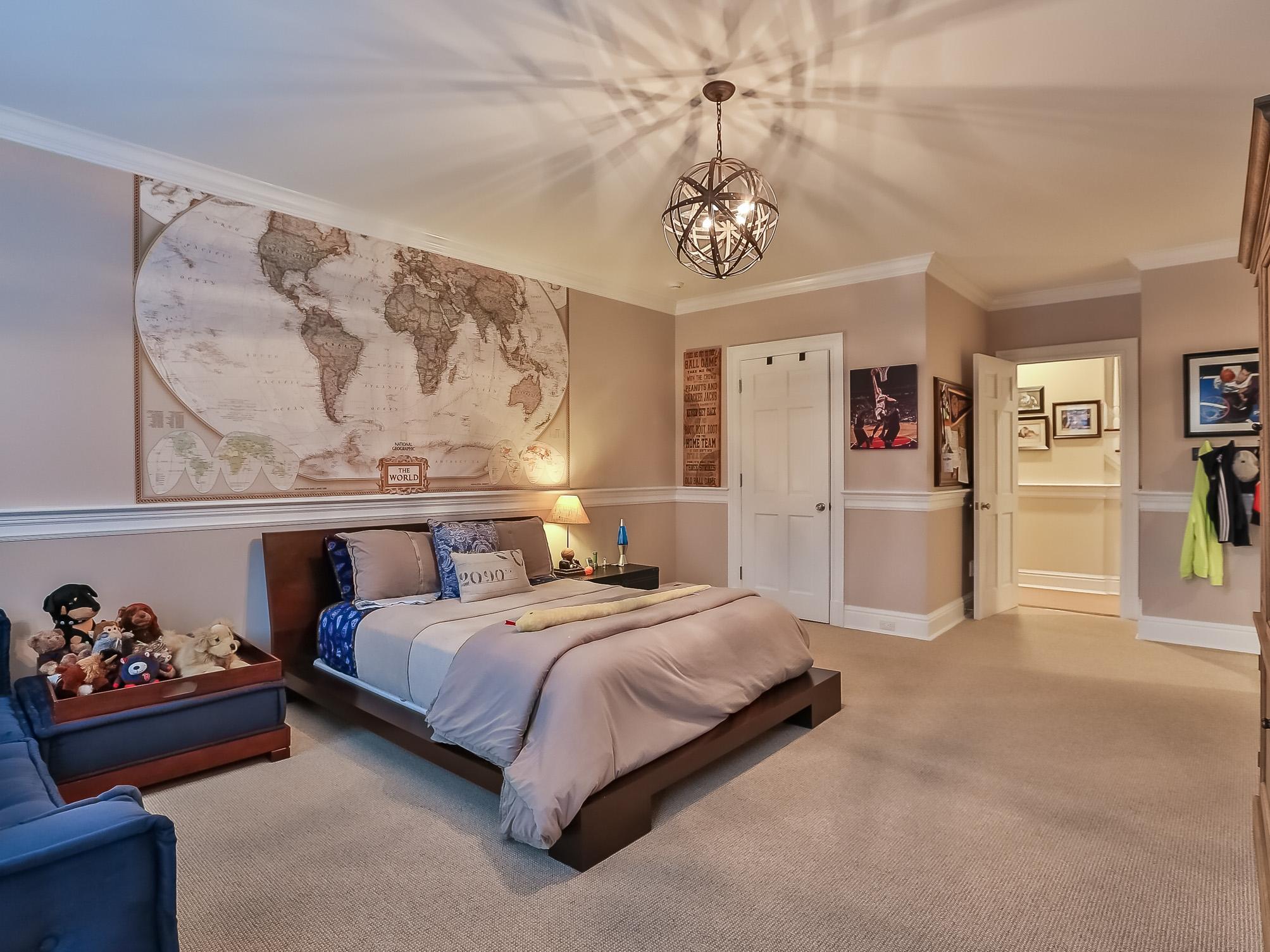 107 Dunning Road New Canaan, CT 06840 - Photo 19 of 31 a bedroom with a bed and a chandelier