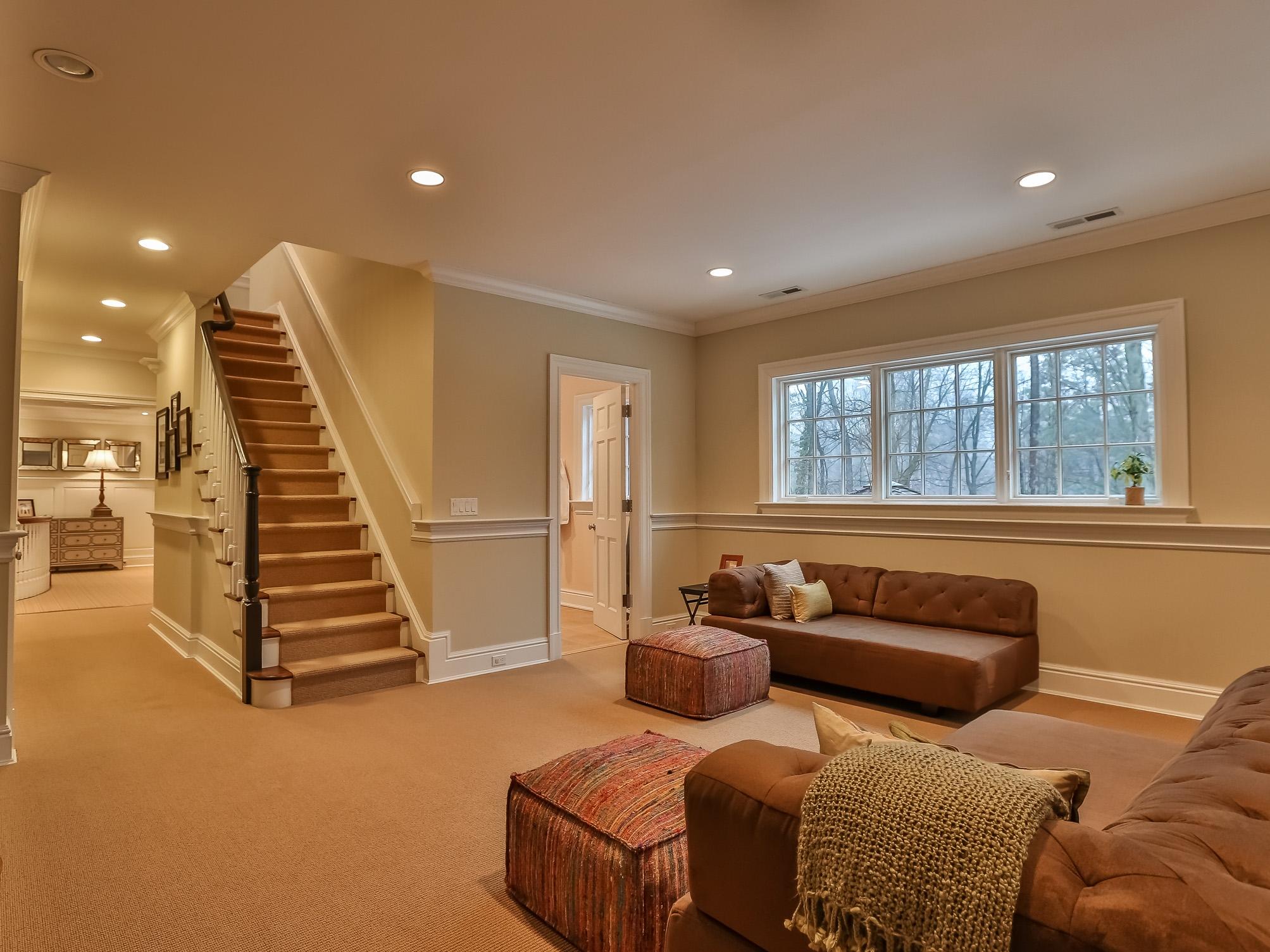 107 Dunning Road New Canaan, CT 06840 - Photo 20 of 31 a living room with furniture and stairs