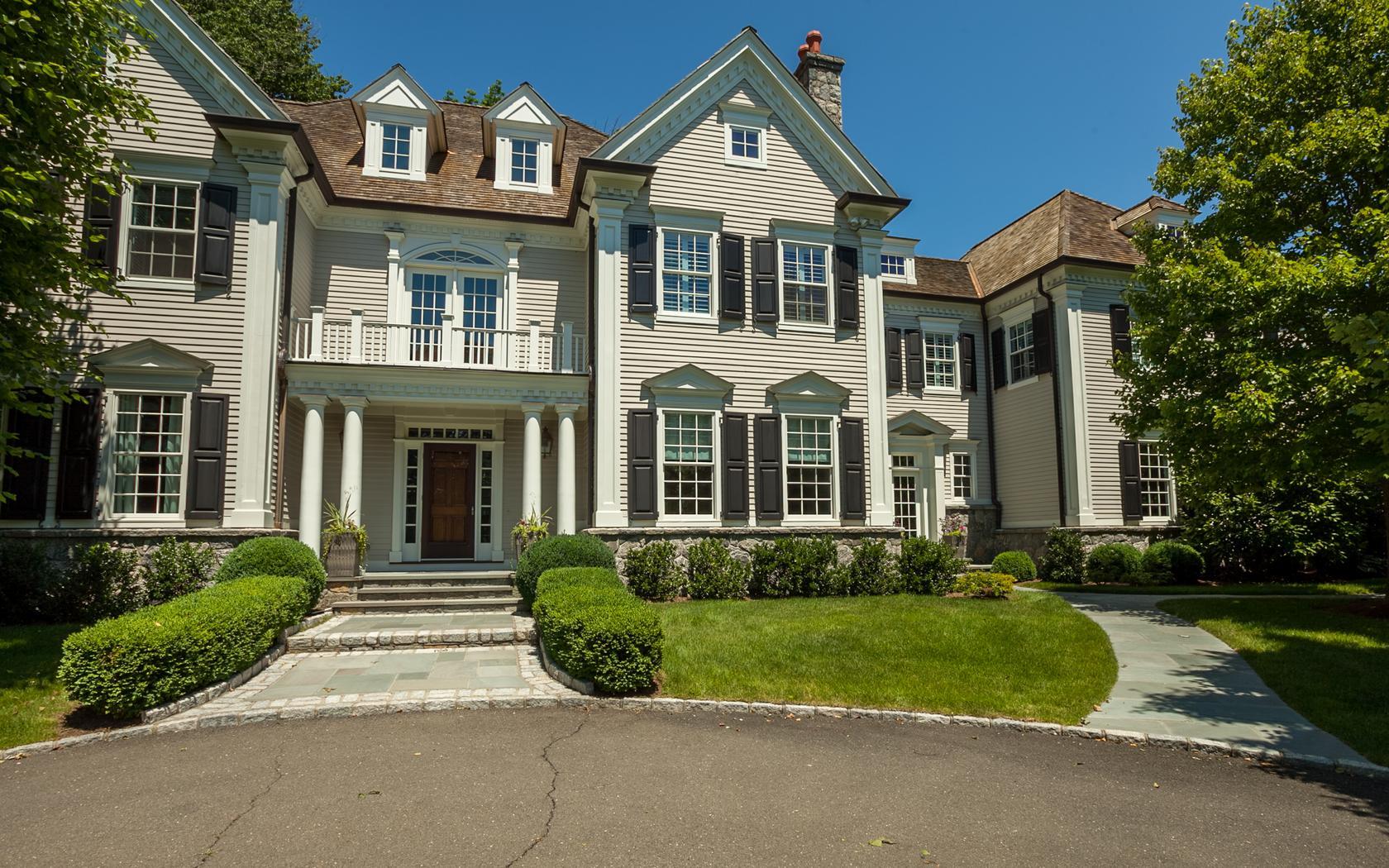 107 Dunning Road New Canaan, CT 06840 - Photo 2 of 31 front view of a house with a yard
