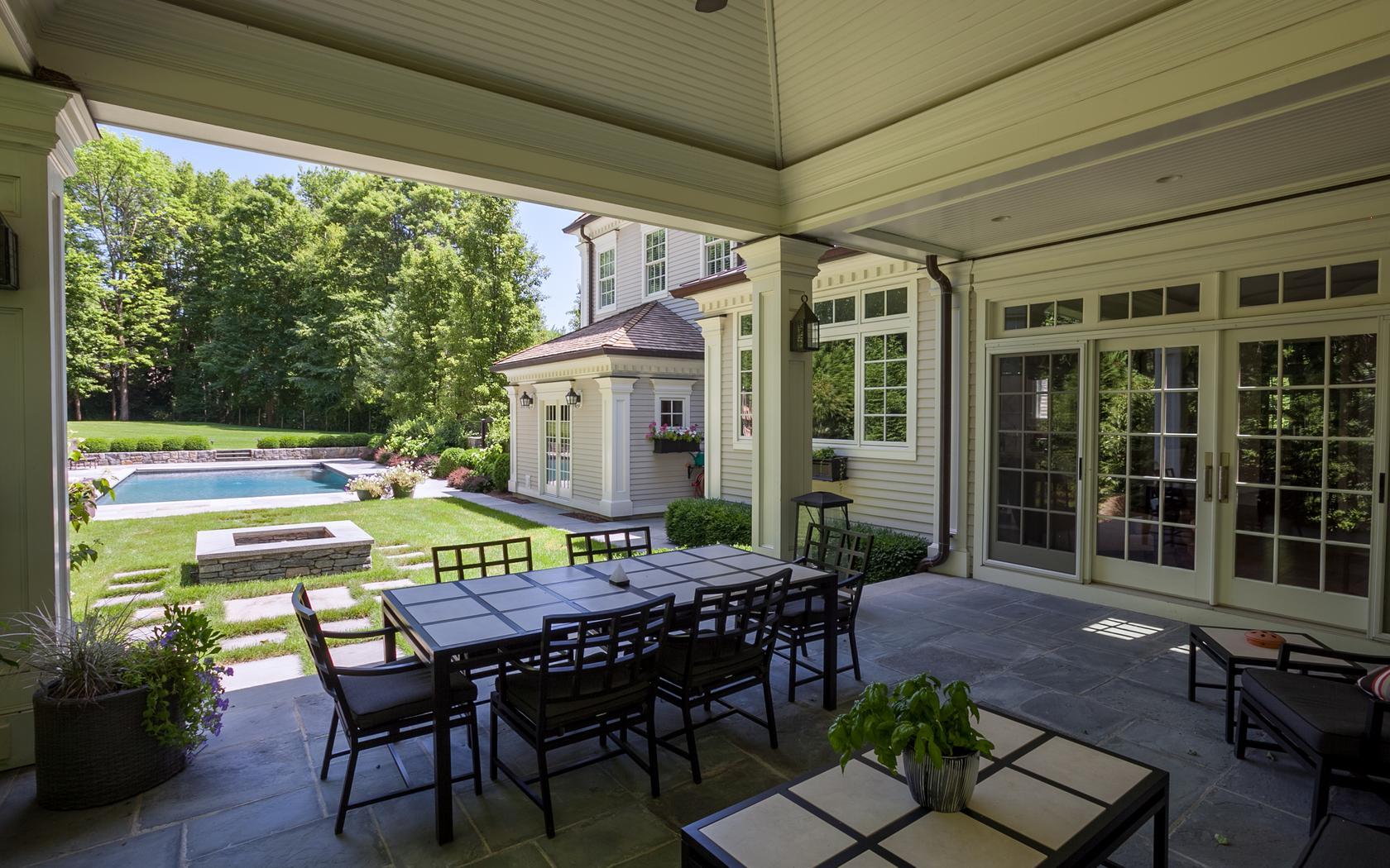 107 Dunning Road New Canaan, CT 06840 - Photo 23 of 31 a view of a patio with table and chairs and potted plants