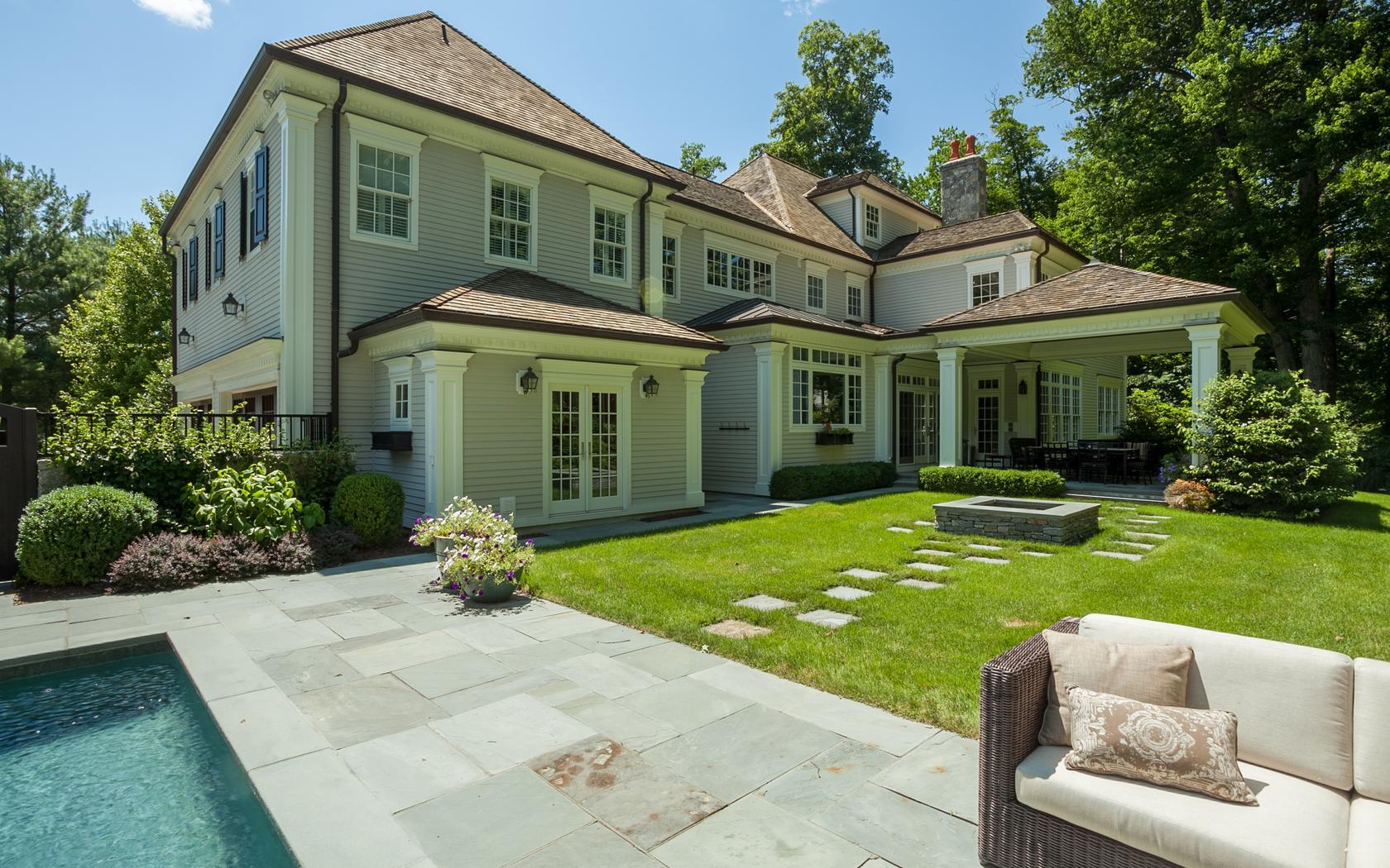 107 Dunning Road New Canaan, CT 06840 - Photo 24 of 31 a front view of a house with garden
