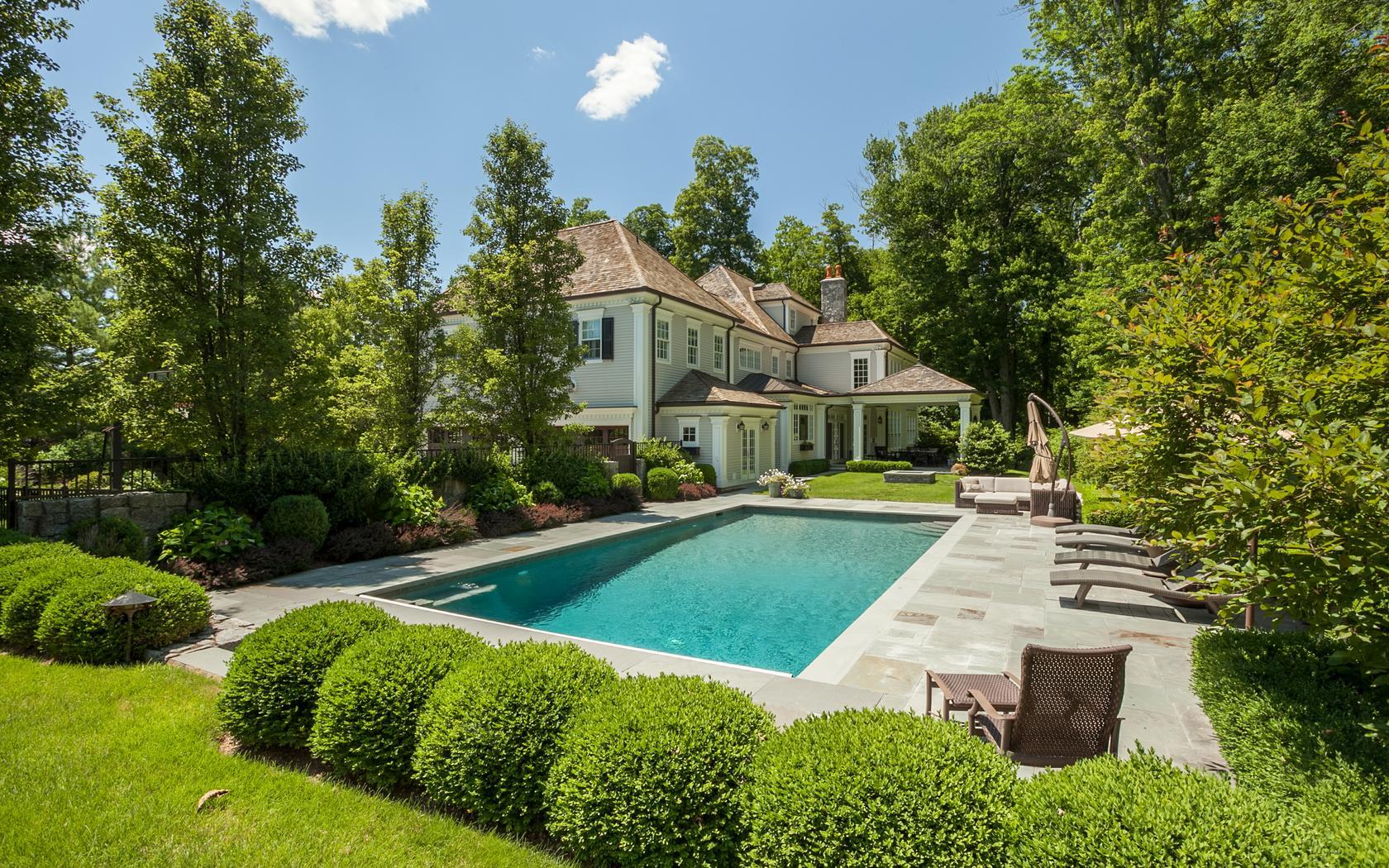 107 Dunning Road New Canaan, CT 06840 - Photo 25 of 31 a house with swimming pool in front of it