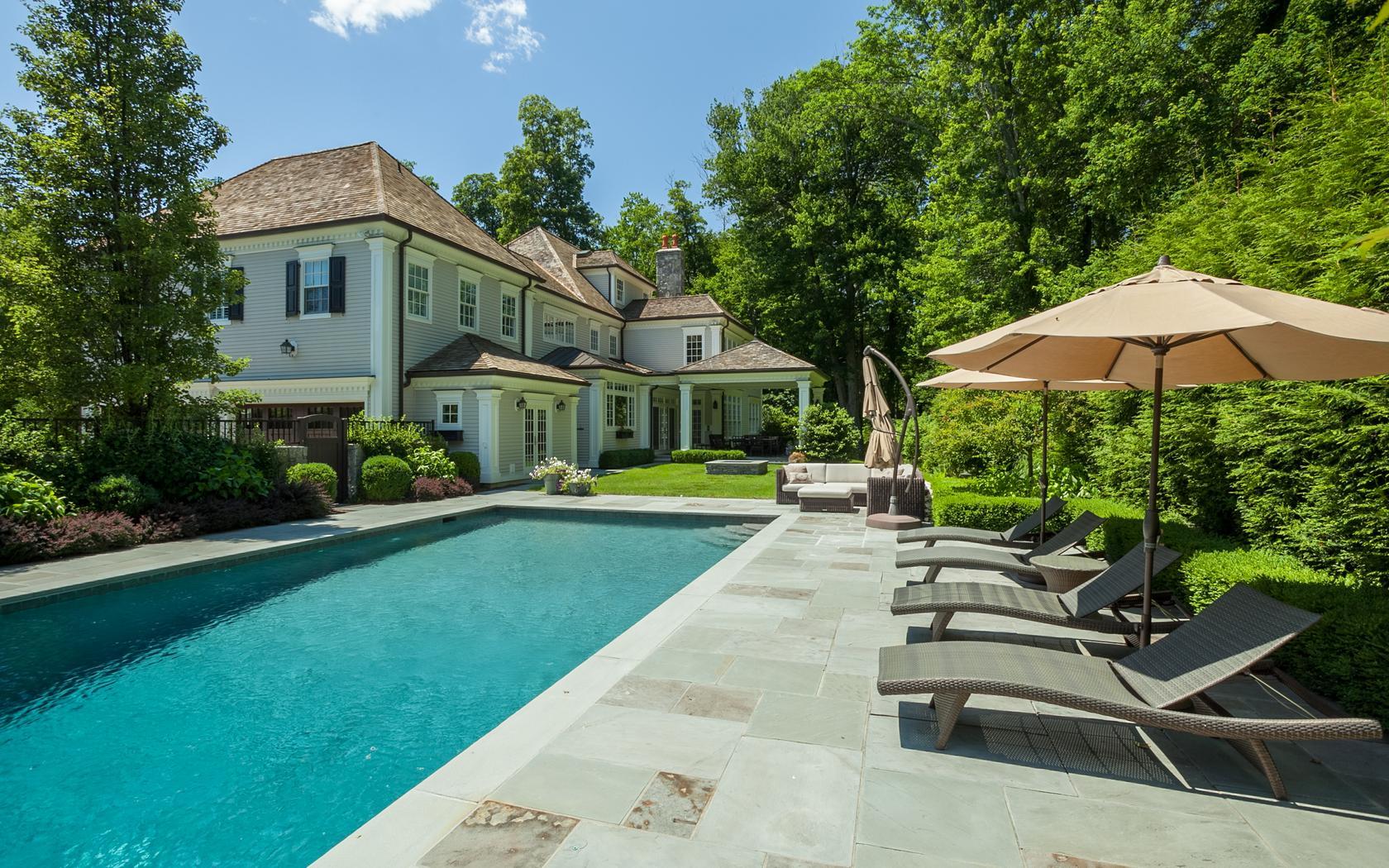 107 Dunning Road New Canaan, CT 06840 - Photo 27 of 31 a house view with swimming pool and glass windows