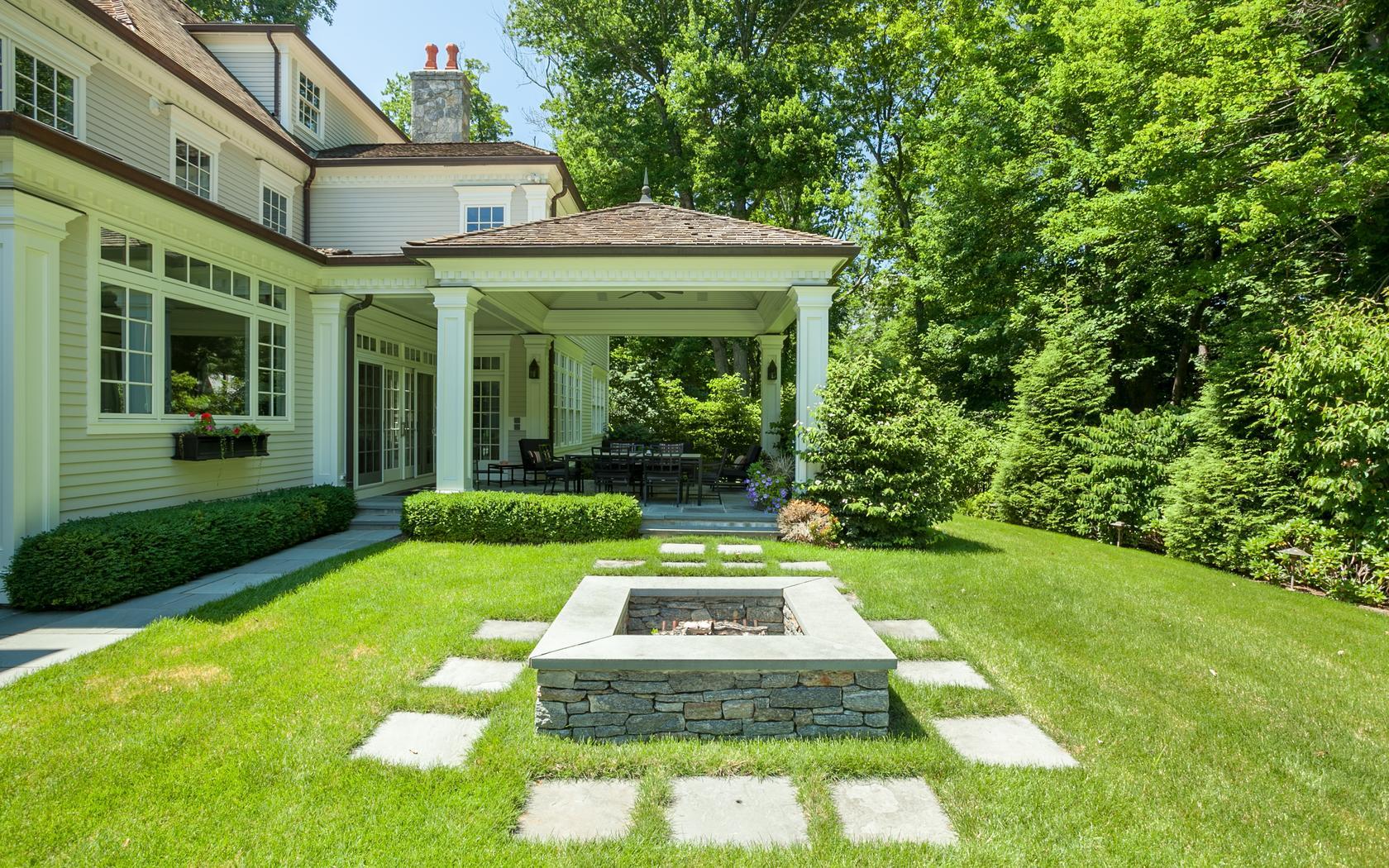 107 Dunning Road New Canaan, CT 06840 - Photo 28 of 31 a front view of a house with garden