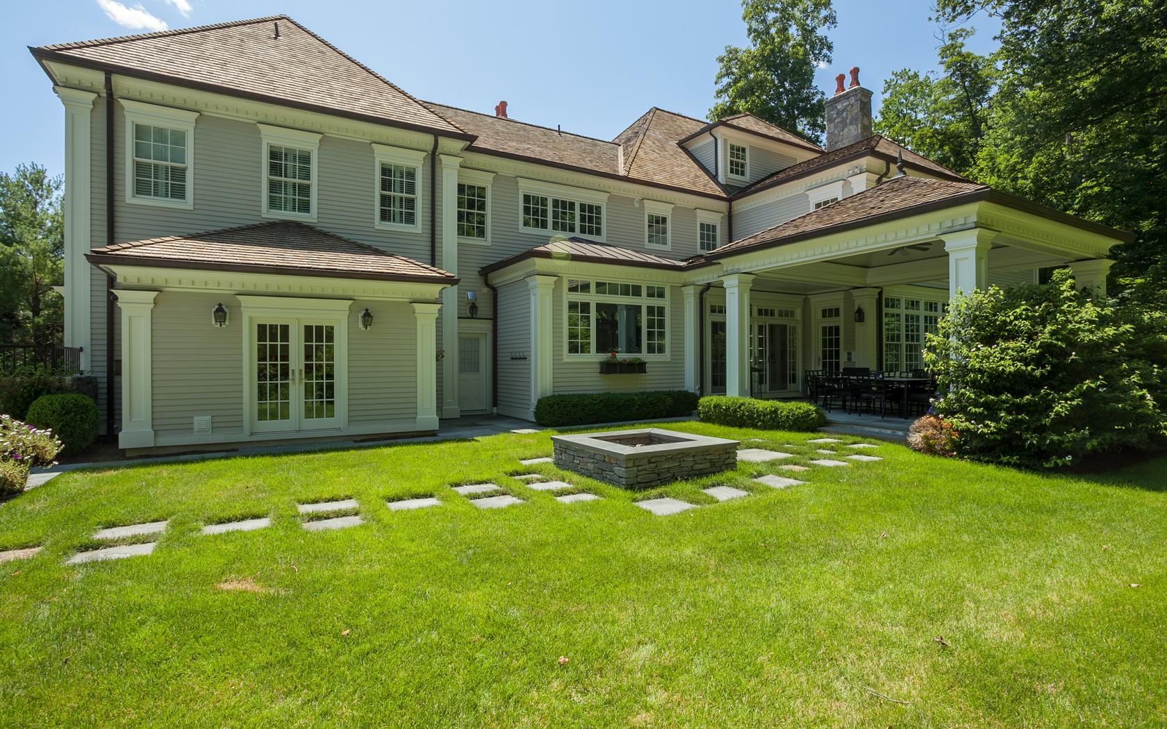 107 Dunning Road New Canaan, CT 06840 - Photo 29 of 31 front view of a house with a yard