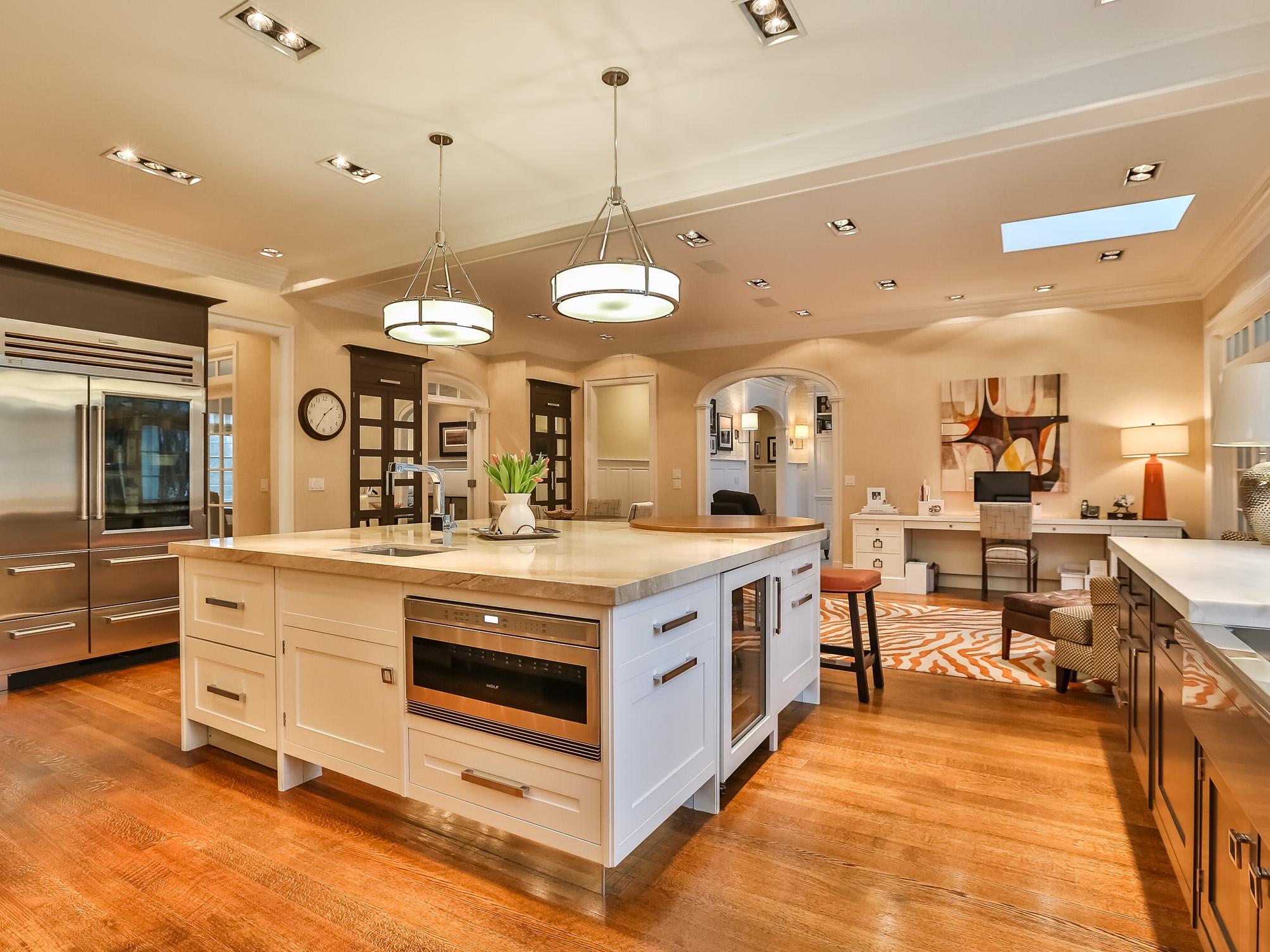 107 Dunning Road New Canaan, CT 06840 - Photo 7 of 31 a large kitchen with stainless steel appliances granite countertop a stove and a view of living room