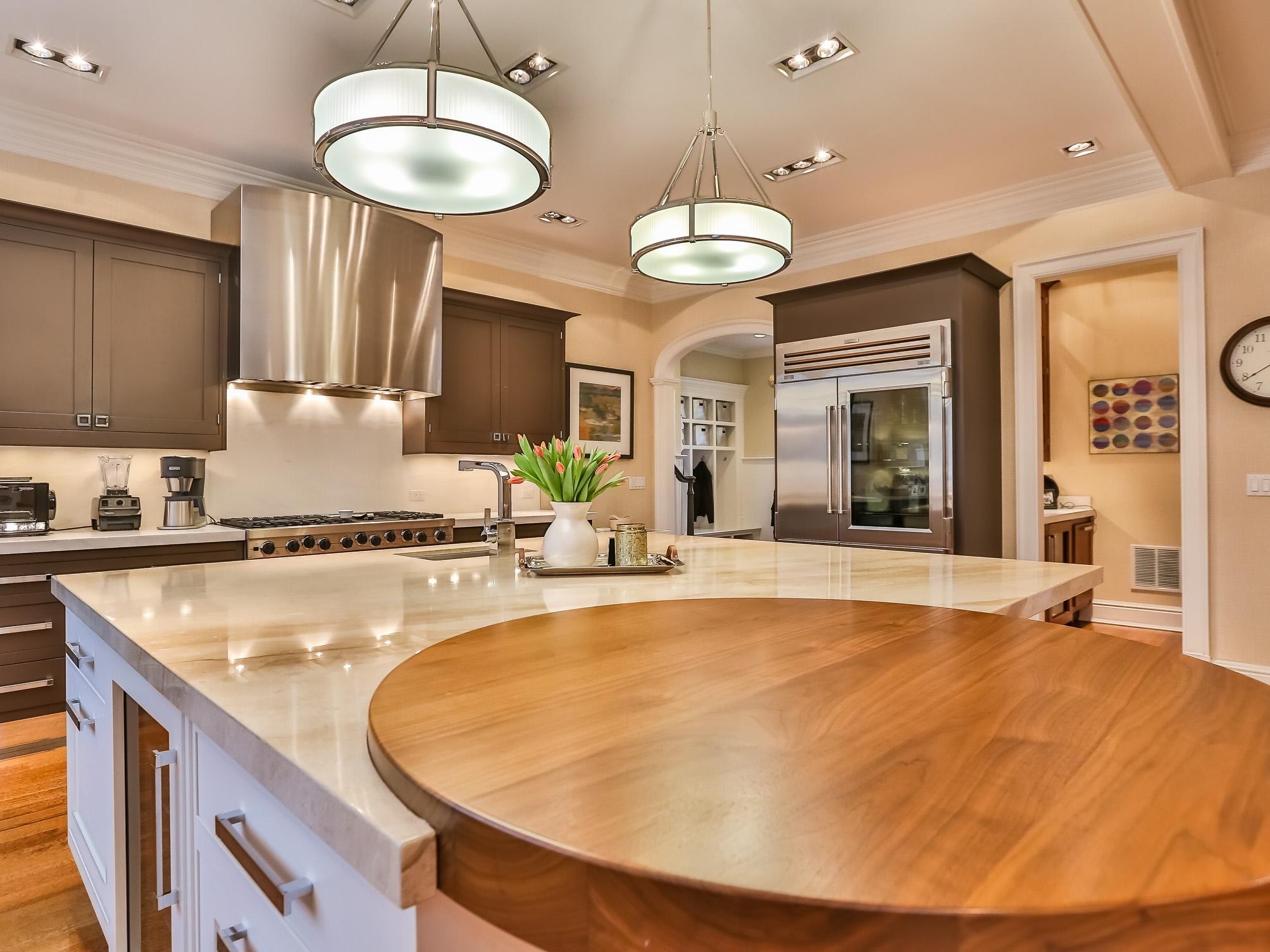 107 Dunning Road New Canaan, CT 06840 - Photo 8 of 31 a large kitchen with kitchen island a large counter space a sink and appliances