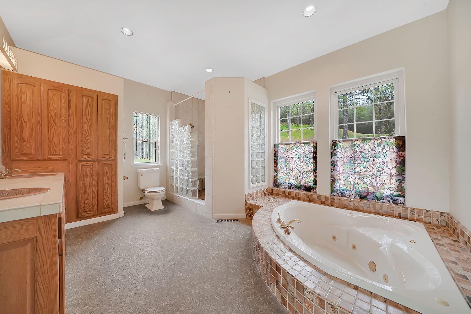 13901 Chestnut Lane Sutter Creek, CA 95685 - Photo 22 of 46 Primary bathroom with sunken jetted tub, double sinks and lots of cabinet storage!