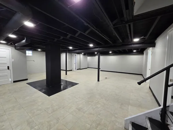 a view of an empty room with a projector