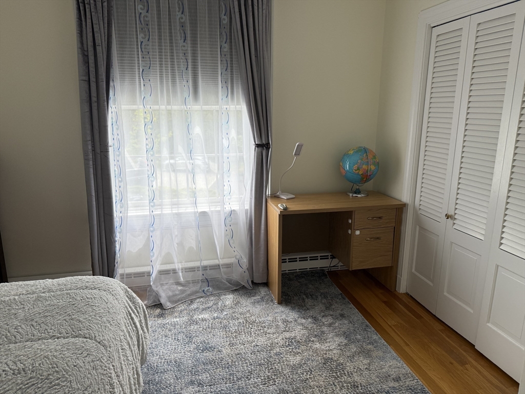 5 Porter Road, Unit 202 Andover, MA 01810 - Photo 12 of 17 a bedroom with a bed and a window