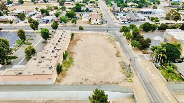 an aerial view of a house with a yard and garden