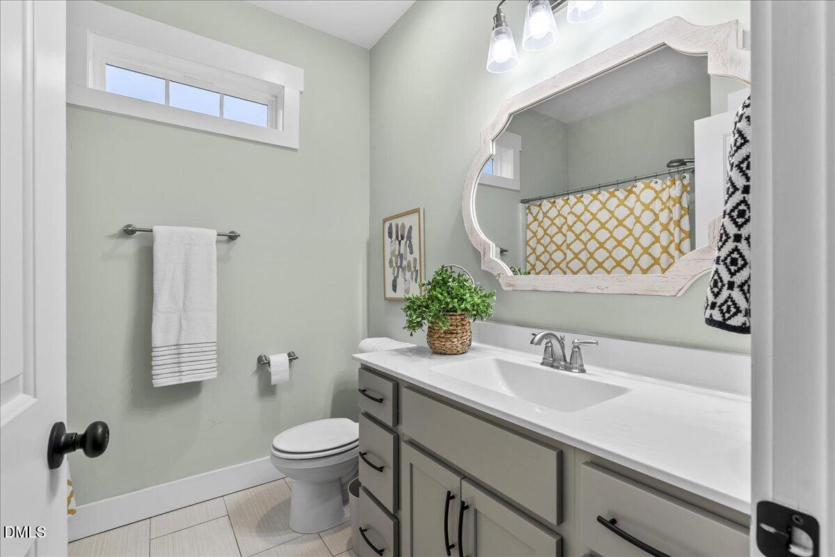47 Kiowa Court Willow Spring, NC 27592 - Photo 19 of 30 a bathroom with a sink toilet and shower