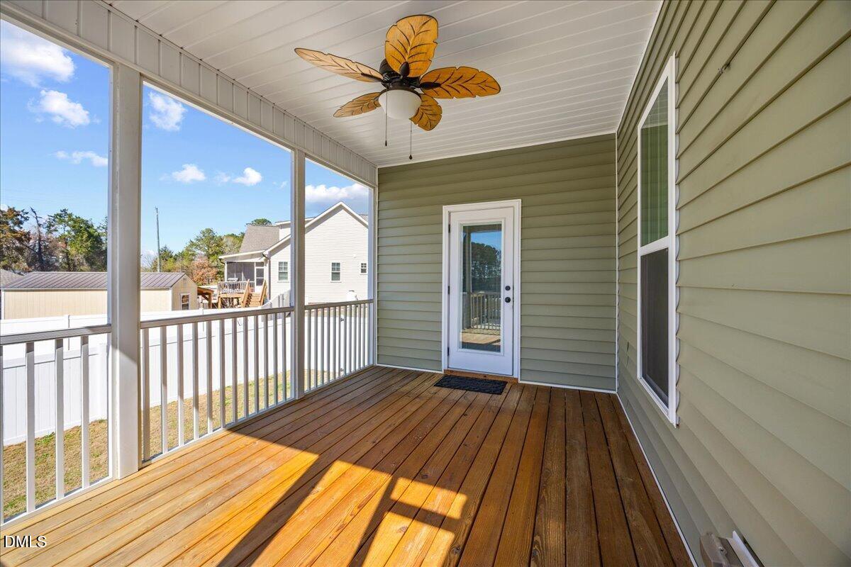 47 Kiowa Court Willow Spring, NC 27592 - Photo 24 of 30 a view of a balcony with wooden floor
