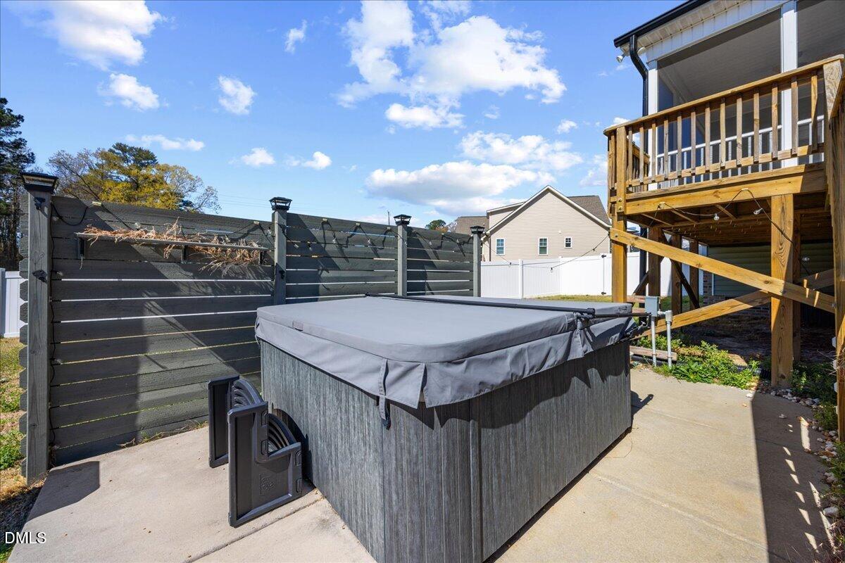47 Kiowa Court Willow Spring, NC 27592 - Photo 28 of 30 a view of a balcony with wooden floor and a potted plant