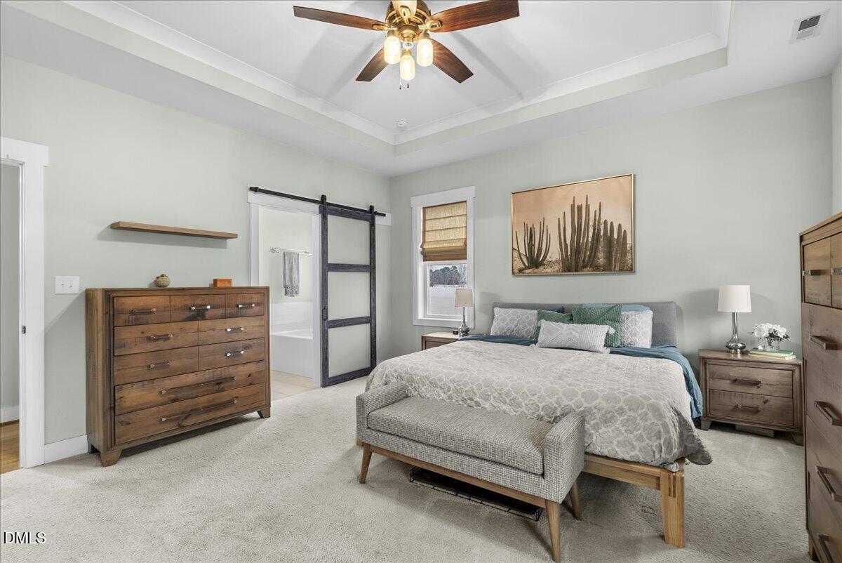 47 Kiowa Court Willow Spring, NC 27592 - Photo 6 of 30 a bedroom with a bed and ceiling fan