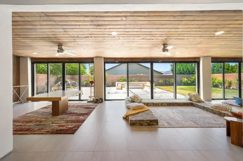 a large pool table and chairs in a room