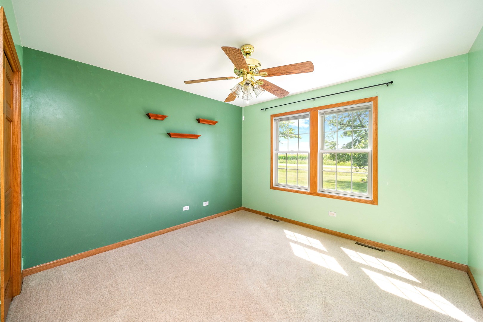 3970 East 2259th Road Serena, IL 60549 - Photo 13 of 39 a view of an empty room with a window and a fan