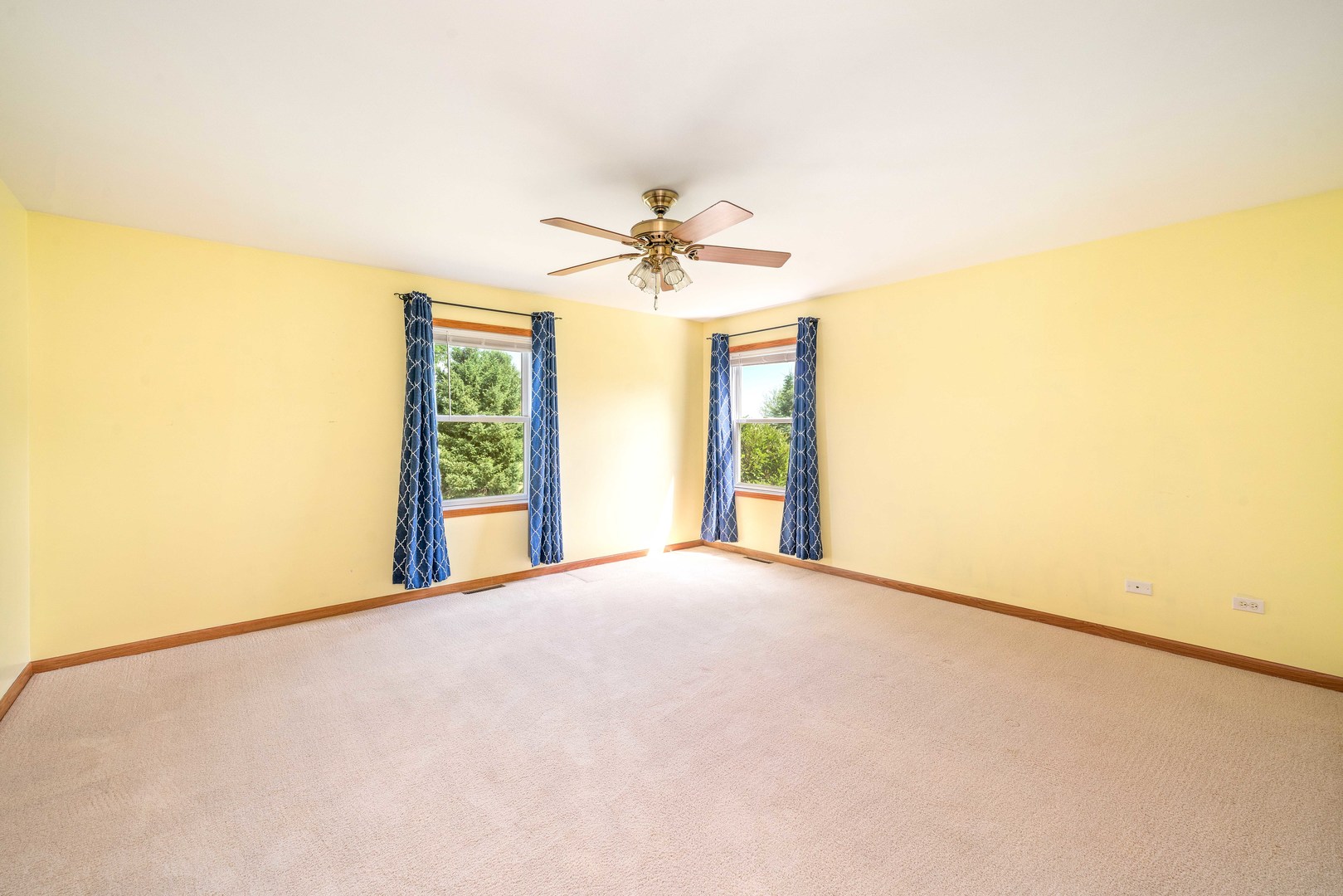 3970 East 2259th Road Serena, IL 60549 - Photo 16 of 39 a view of a big room with windows and chandelier fan
