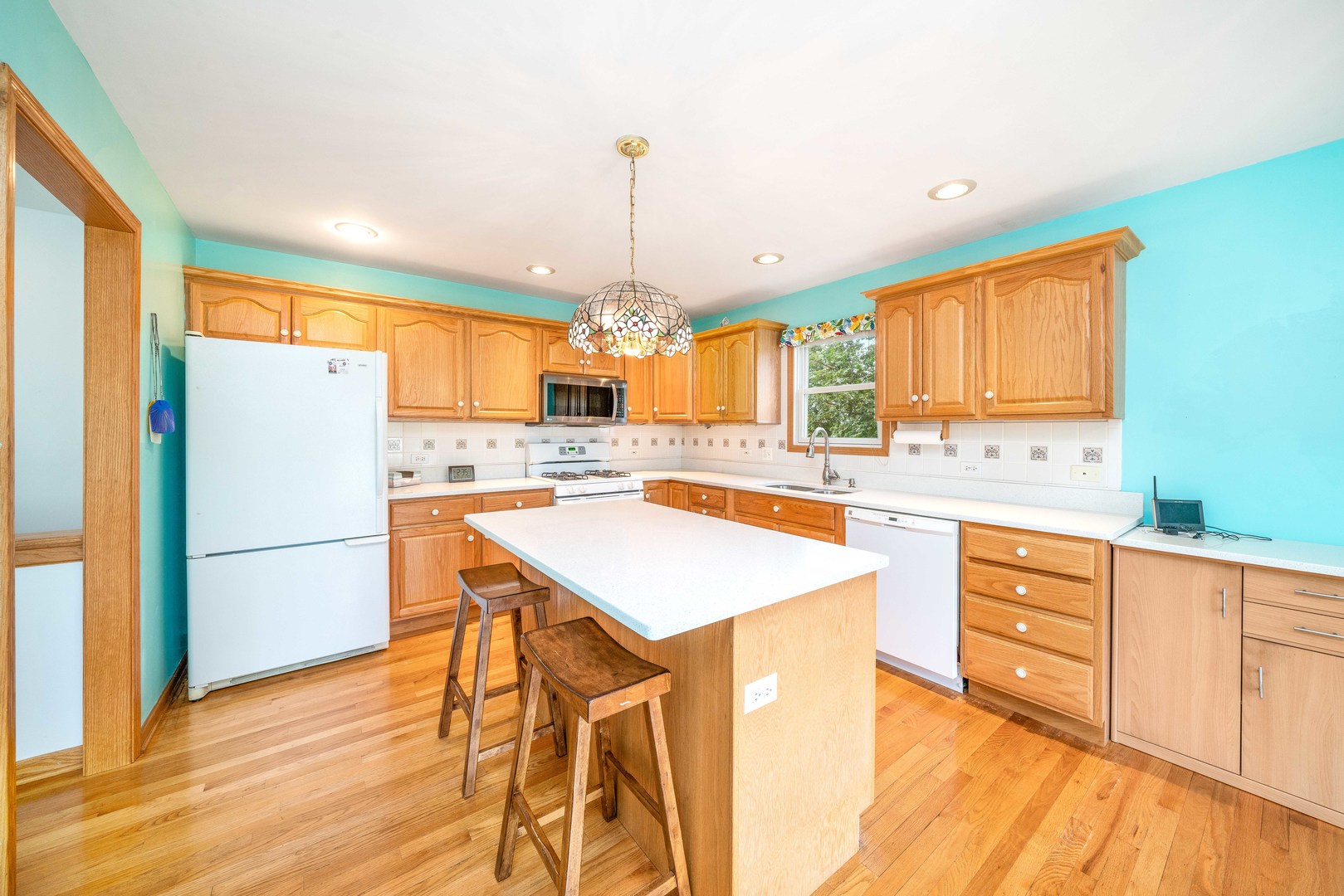 3970 East 2259th Road Serena, IL 60549 - Photo 7 of 39 a kitchen with a refrigerator a sink dishwasher with a dining table and chairs