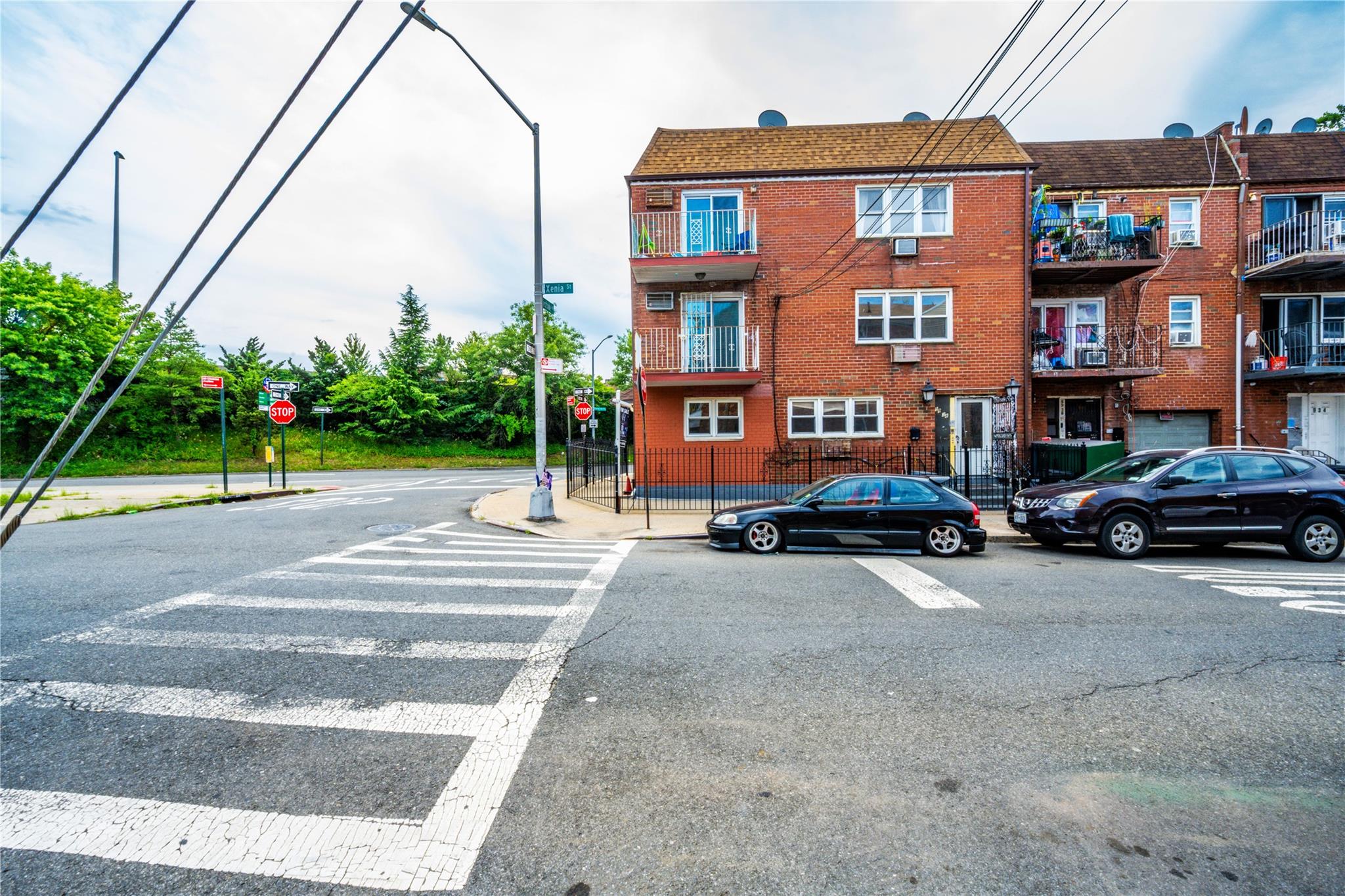 59-38 Xenia Street Queens, NY 11368 - Photo 1 of 16 a view of a street with cars