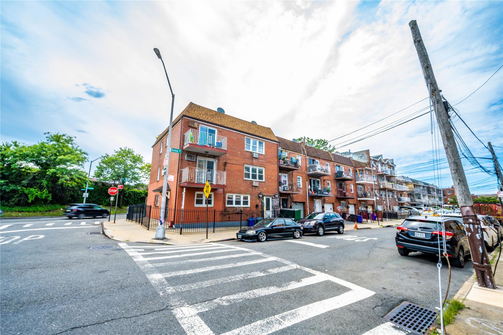 59-38 Xenia Street Queens, NY 11368 - Photo 2 of 16 a view of a street with cars