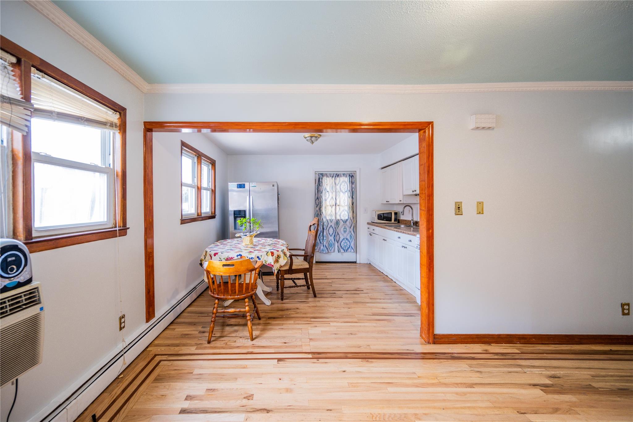 59-38 Xenia Street Queens, NY 11368 - Photo 4 of 16 a dining room with furniture and wooden floor