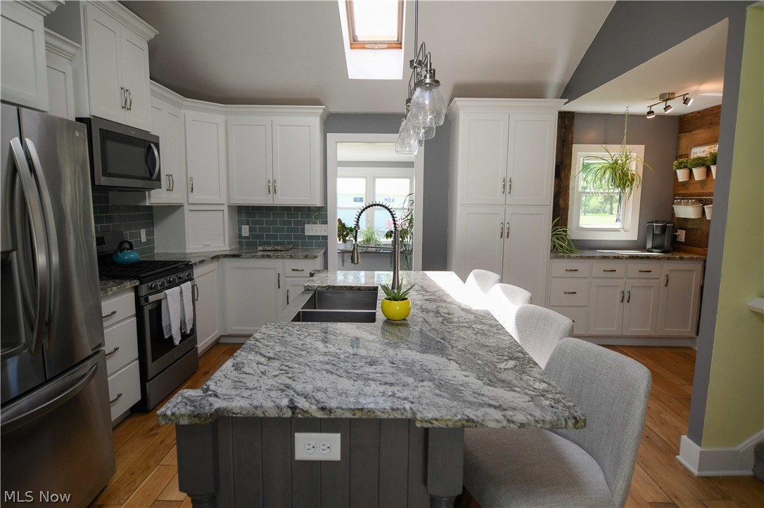 4540 Ridge Road Medina, OH 44256 - Photo 4 of 49 Island with durable granite counters and space for 4 chairs.