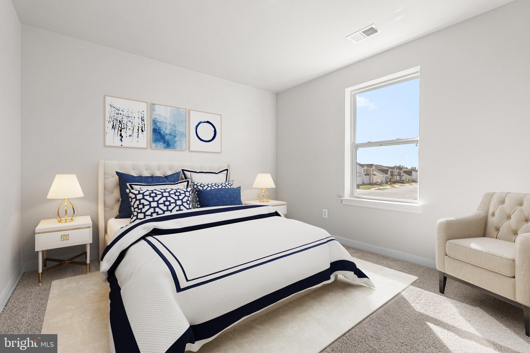 171 Huntwell W Avenue Ranson, WV 25438 - Photo 11 of 20 a bedroom with a bed and a lamp