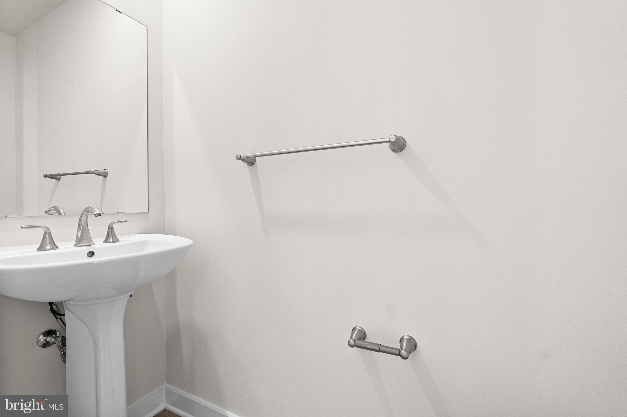 171 Huntwell W Avenue Ranson, WV 25438 - Photo 16 of 20 a bathroom with a sink and mirror