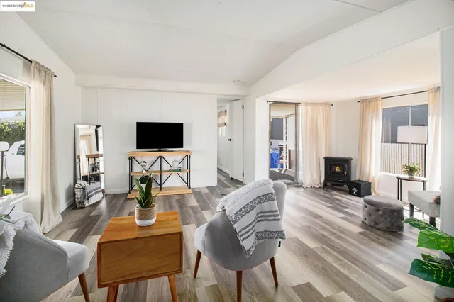 a living room with fireplace furniture and a flat screen tv
