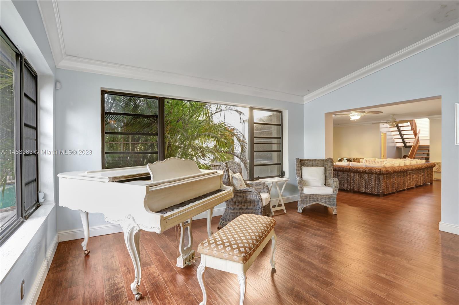 7700 Hawthorne Avenue Miami Beach, FL 33141 - Photo 13 of 36 a living room with furniture and a large window