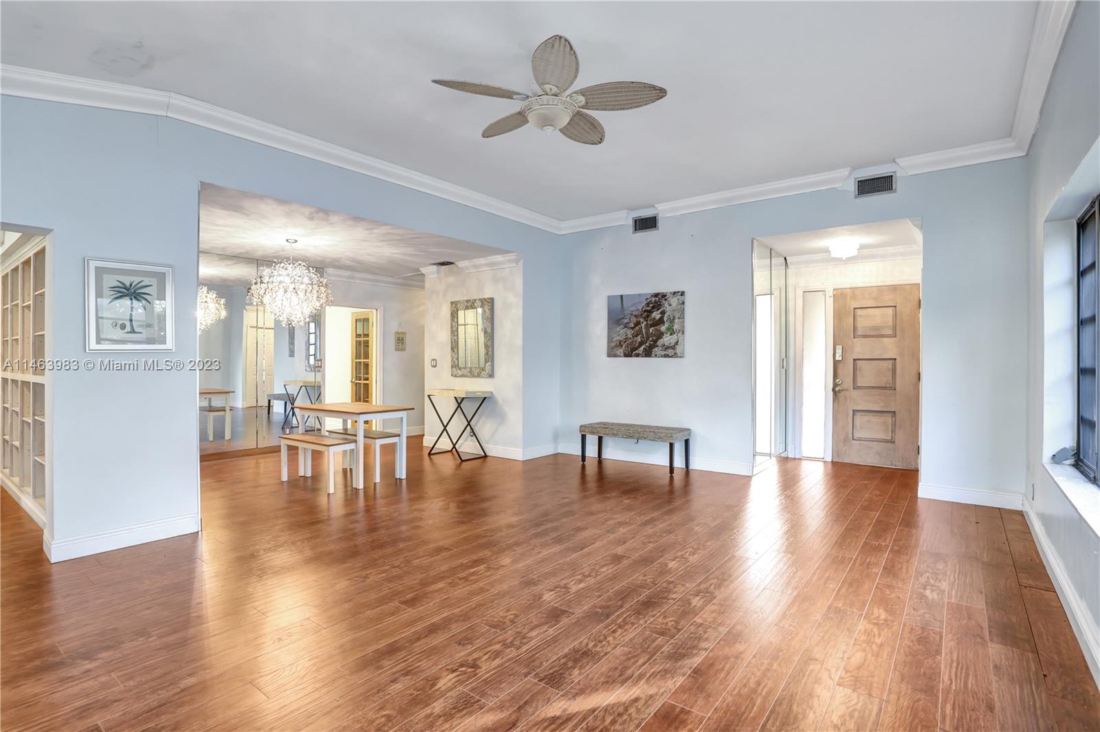 7700 Hawthorne Avenue Miami Beach, FL 33141 - Photo 14 of 36 a view of dining room with furniture and wooden floor