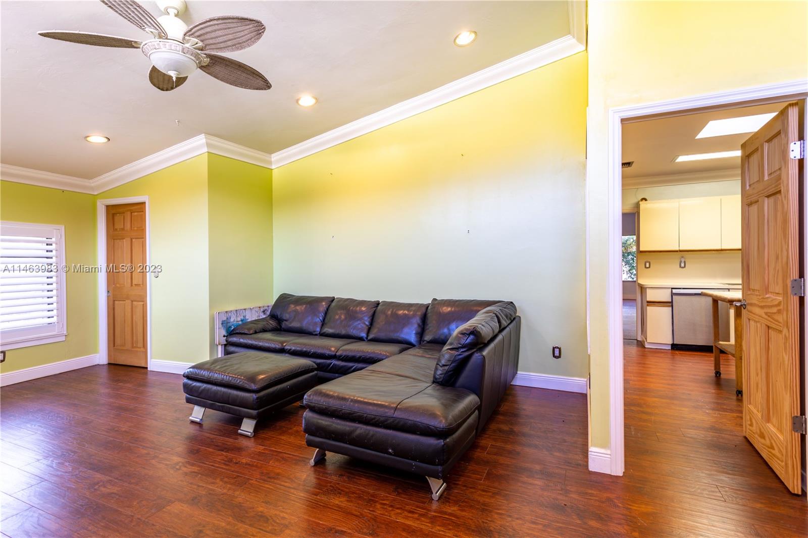 7700 Hawthorne Avenue Miami Beach, FL 33141 - Photo 17 of 36 a living room with furniture and a wooden floor
