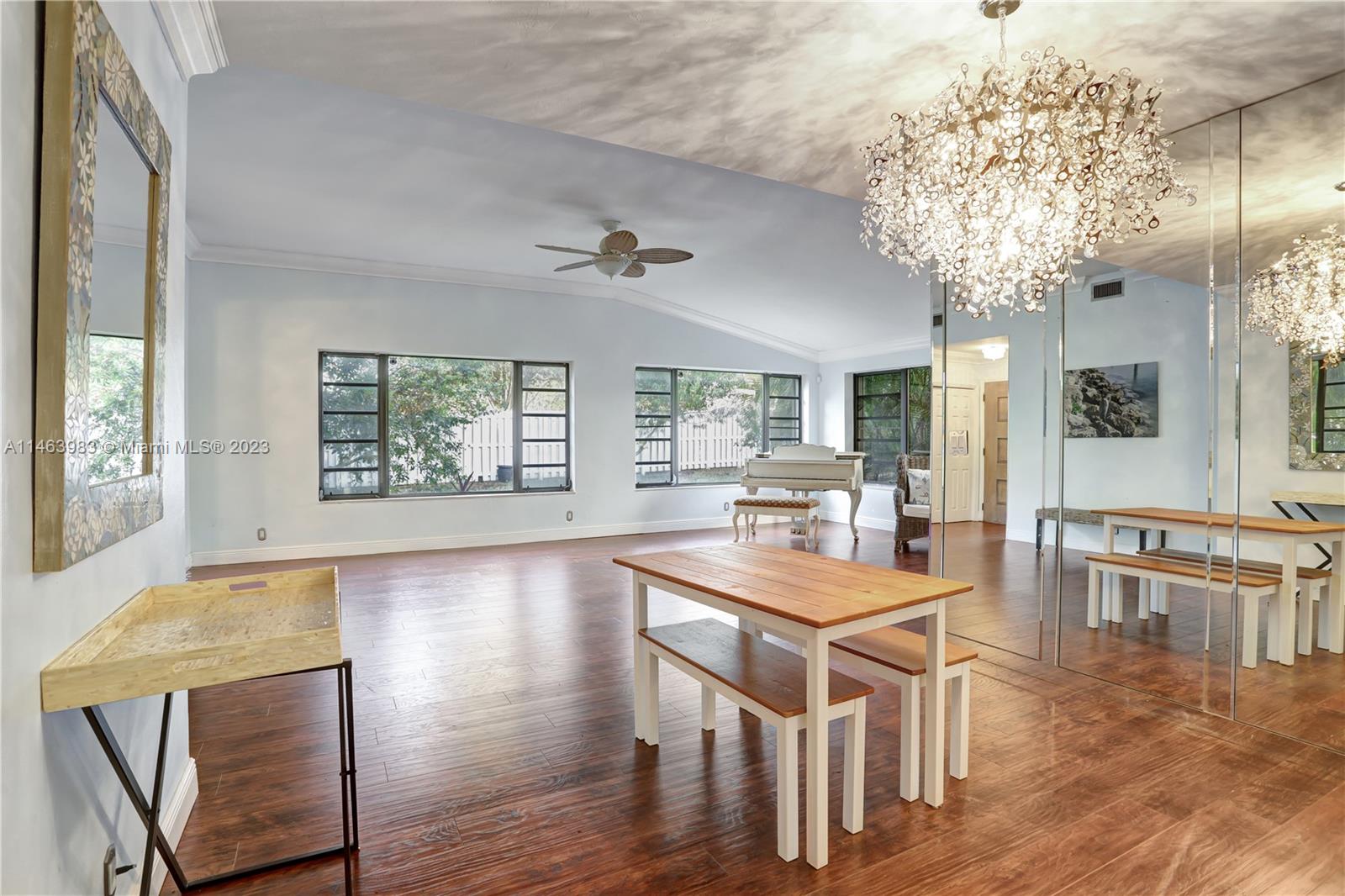 7700 Hawthorne Avenue Miami Beach, FL 33141 - Photo 25 of 36 a view of a dining room with furniture and wooden floor