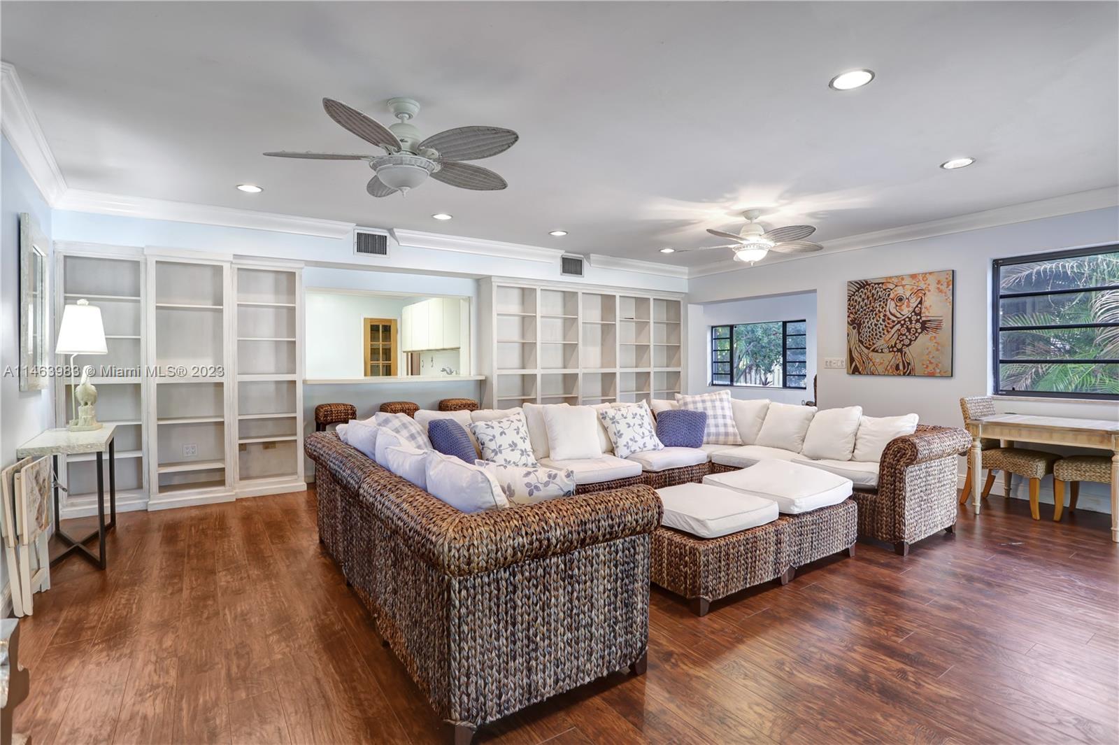 7700 Hawthorne Avenue Miami Beach, FL 33141 - Photo 27 of 36 a living room with furniture and a wooden floor