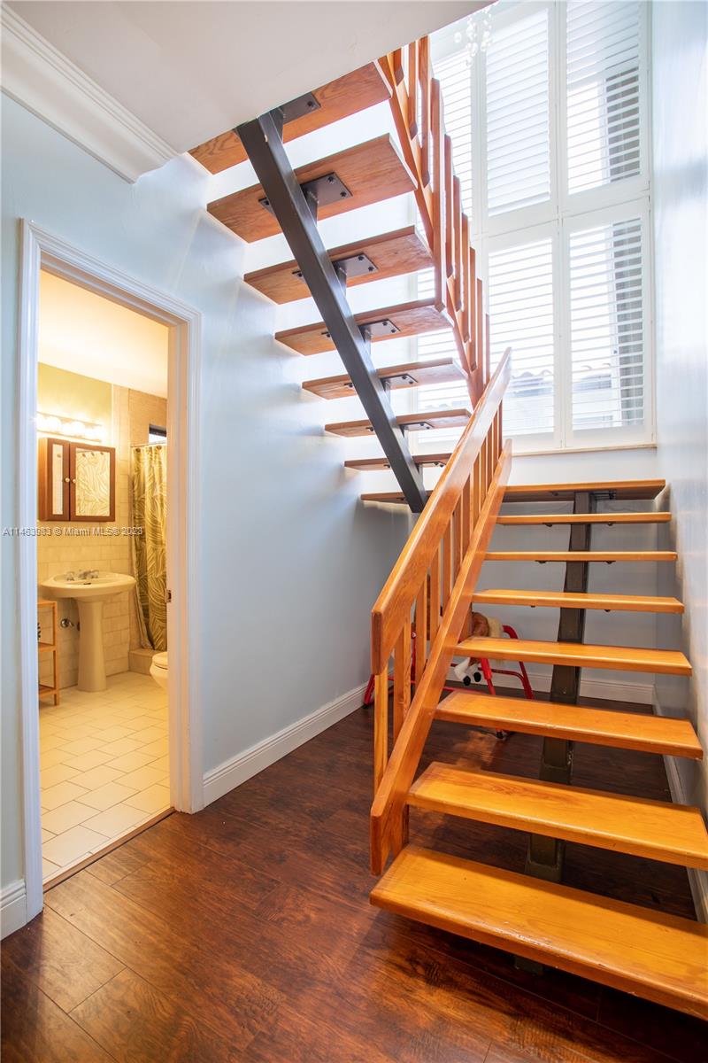 7700 Hawthorne Avenue Miami Beach, FL 33141 - Photo 28 of 36 a view of entryway and hall with wooden floor