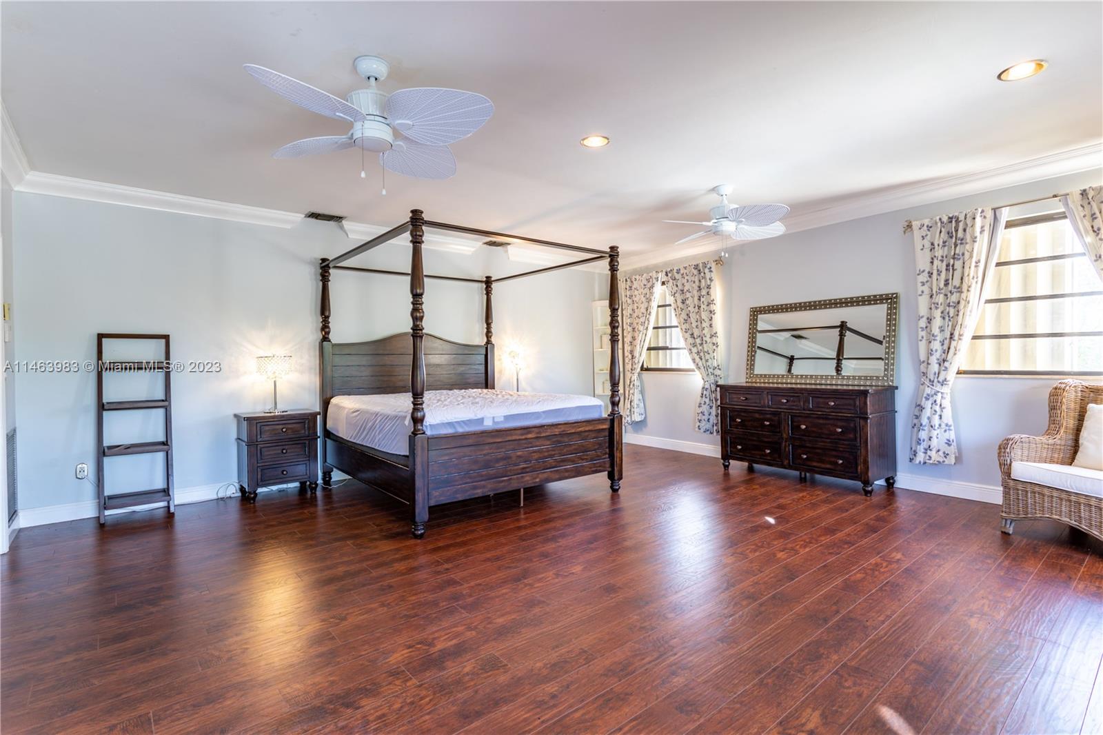 7700 Hawthorne Avenue Miami Beach, FL 33141 - Photo 29 of 36 a bedroom with furniture and wooden floor