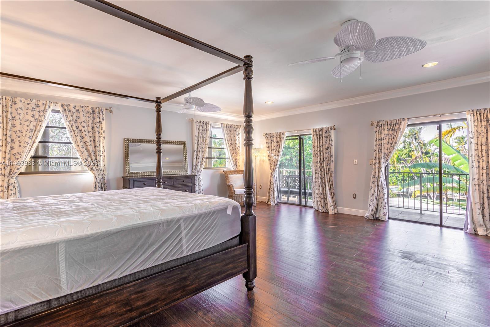 7700 Hawthorne Avenue Miami Beach, FL 33141 - Photo 30 of 36 a bedroom with a large bed and a large window